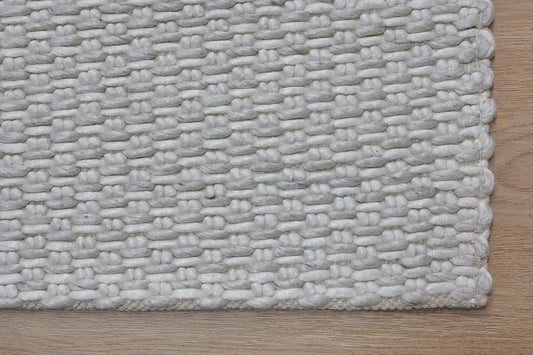 Ankara White/Cream is a Hand-woven, textured rug crafted from a luxurious combination of wool and bamboo silk. Colour White/Cream. Sizes 160 X 230, 200 X 290, and 240 X 340. Corner.
