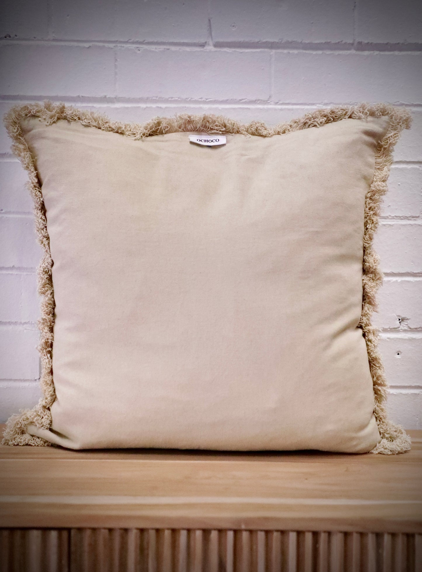 Our Antique Cream, cushion is hand crafted in India by skilled artisans. Features a soft feel, with small fringes around the edges. Colour Cream. Sizes 50 X 50 and 60 X 60. Back.