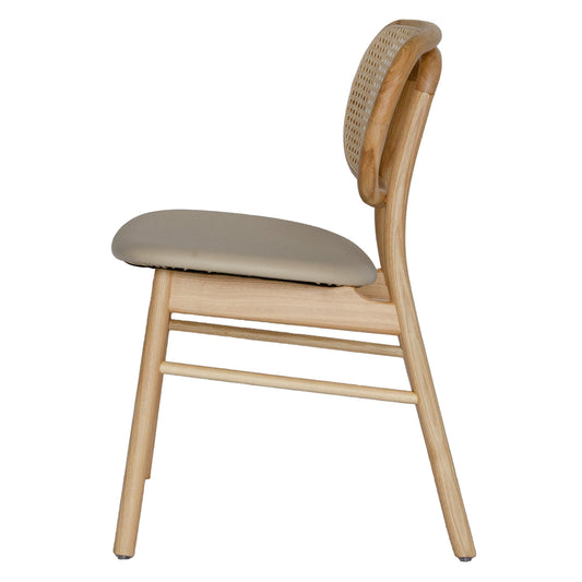 The Apache - Natural Dining Chair is a coastal/contemporary dining chair. Crafted with solid ash frame, polyurethane seat and a rattan back. Colours Natural Frame, Natural Polyurethane seat and natural rattan seat back. Measuring 530 wide x 550 depth x 450 seat height and a back height of 780. Side.