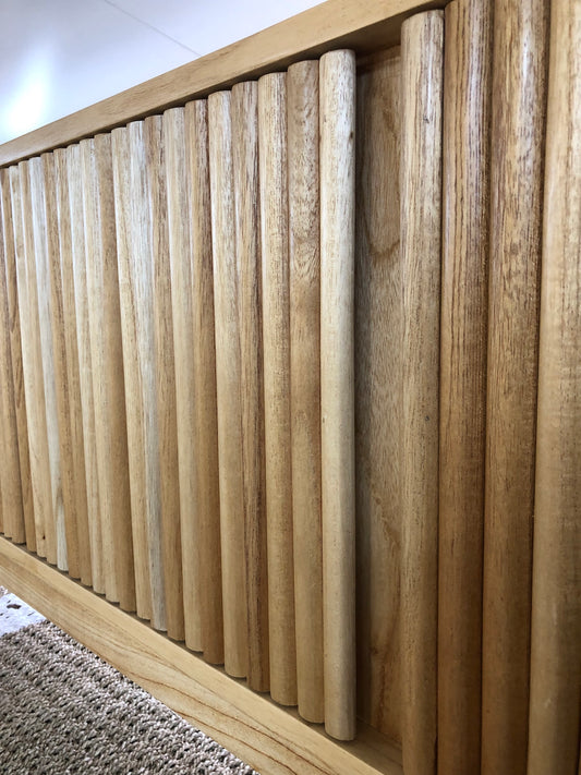 The Astoria 4 Door Natural Buffet is a contemporary styled piece. Crafted from sustainable white cedar, it features 4 textured doors. Colour Black. Measures 1800 length X 400 depth X 700 height. Front Angle.