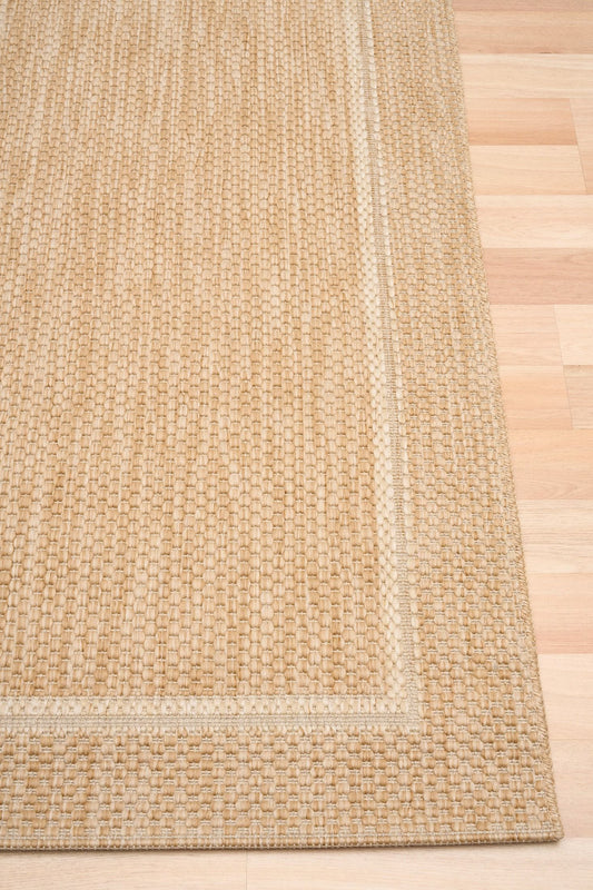 Barton Beige 41505 indoor/outdoor rug featuring soft beige tones and a subtle textured pattern, power-loomed from UV-stabilised polypropylene for lasting durability. Colour Beige. 3 sizes. Corner.
