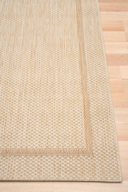 Barton Cream 41505 indoor/outdoor rug featuring soft cream tones and a subtle textured pattern, power-loomed from UV-stabilised polypropylene for lasting durability. Colour Cream. 3 sizes. Corner.