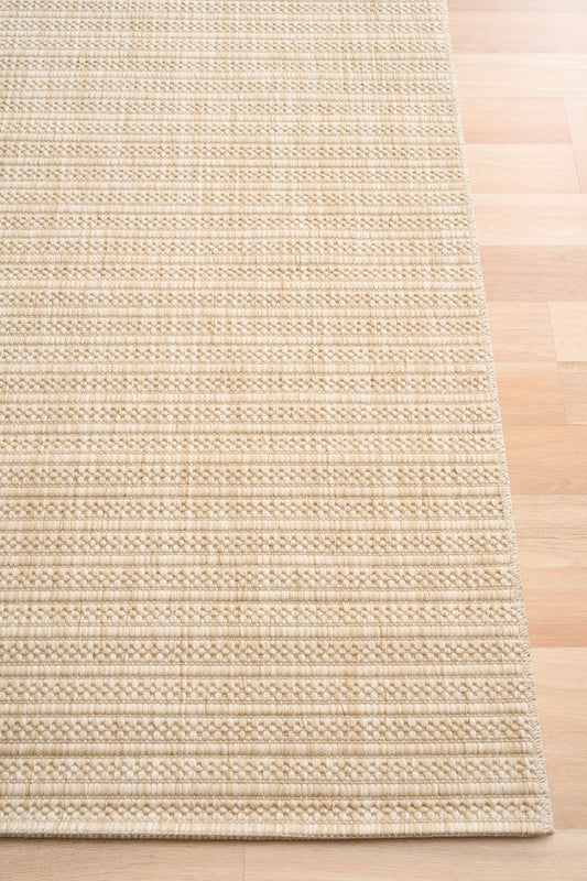 Barton Cream 41524 indoor/outdoor rug featuring soft cream tones and a subtle textured pattern, power-loomed from UV-stabilised polypropylene for lasting durability. Colour Cream. 3 sizes. Corner.