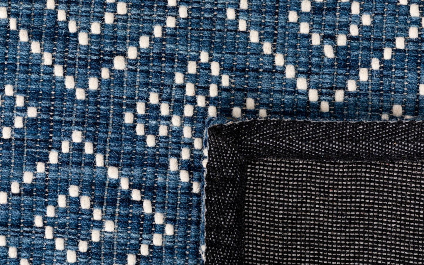 Bellevue Blue is a textured hand woven wool and viscose rug. Featuring a tribal diamond aztec design. Colours Blue with White Patterns. Sizes 200 X 290 and 300 X 400. Fold.