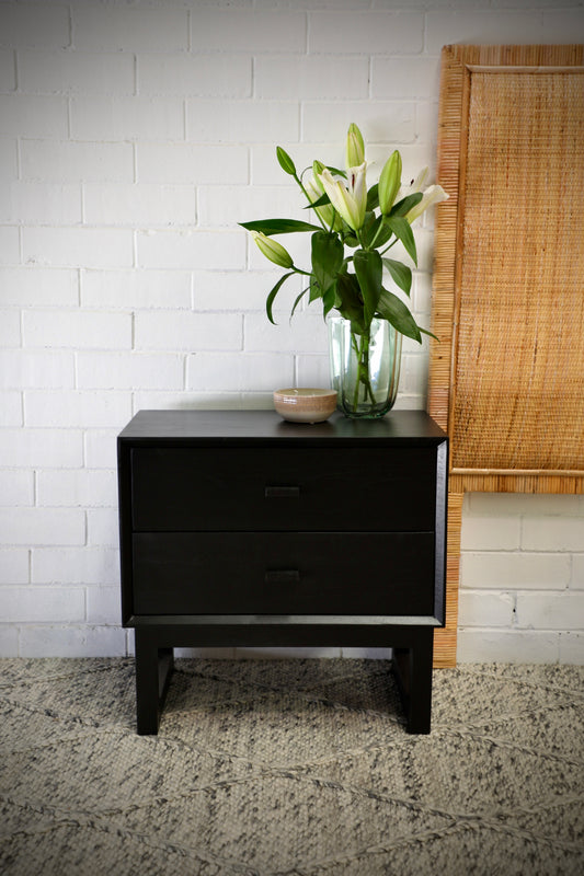 The Blackcomb 2 Drawer bedside is a modern/contemporary designed nightstand. Crafted from sustainable-sourced white cedar, it features 2 drawers with wooden drawer runners. Colour Black. Measures 600 wide X 350 depth X 500 height. Front Styled.