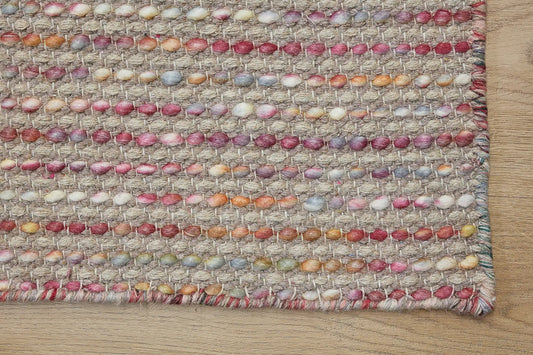 Boa - Flower is a hand-woven flatweave, made of wool with a pile height of 7-9mm. Colours Beige with Cream, Yellow and Brown accents. Sizes 160 X 230, 200 X 290, and 240 X 340. Corner.