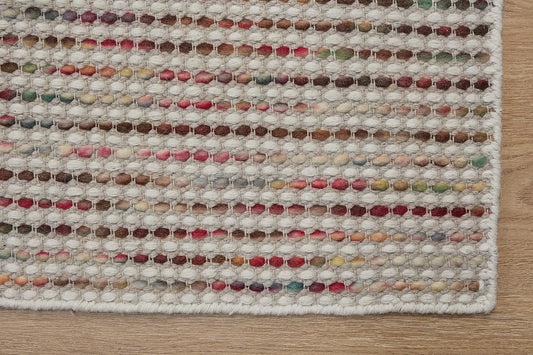 Boa - Petal is a hand-woven flatweave, made of wool with a pile height of 7-9mm. Colours Cream with Multi coloured accents. Sizes 160 X 230, 200 X 290, and 240 X 340. Corner.