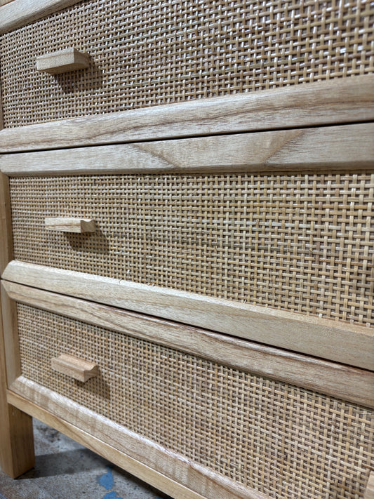 The Booderee 3 Drawer Chest is a coastal/contemporary chest made of natural white cedar and features a closed mesh rattan drawer front. Colour natural. Measures 800 length X 400 depth X 700 height. Angle.