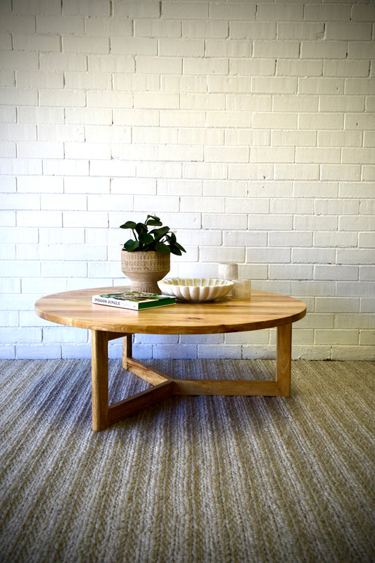 The Bowie Coffee table is a contemporary styled 3 legged round coffee table. Crafted from sustainable fruitwood. Colour natural. Measures 1100 diameter X 400 height. Front Styled.