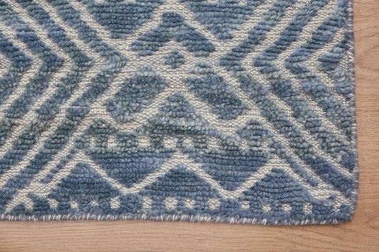 Brazil - Sky is a Boho Tribal Hand-Knotted Wool and Bamboo Silk Rug with a pile height of 7-9mm. Colours Blue with Light Grey accents. Sizes 160 X 230, 200 X 290, and 240 X 340. Corner.