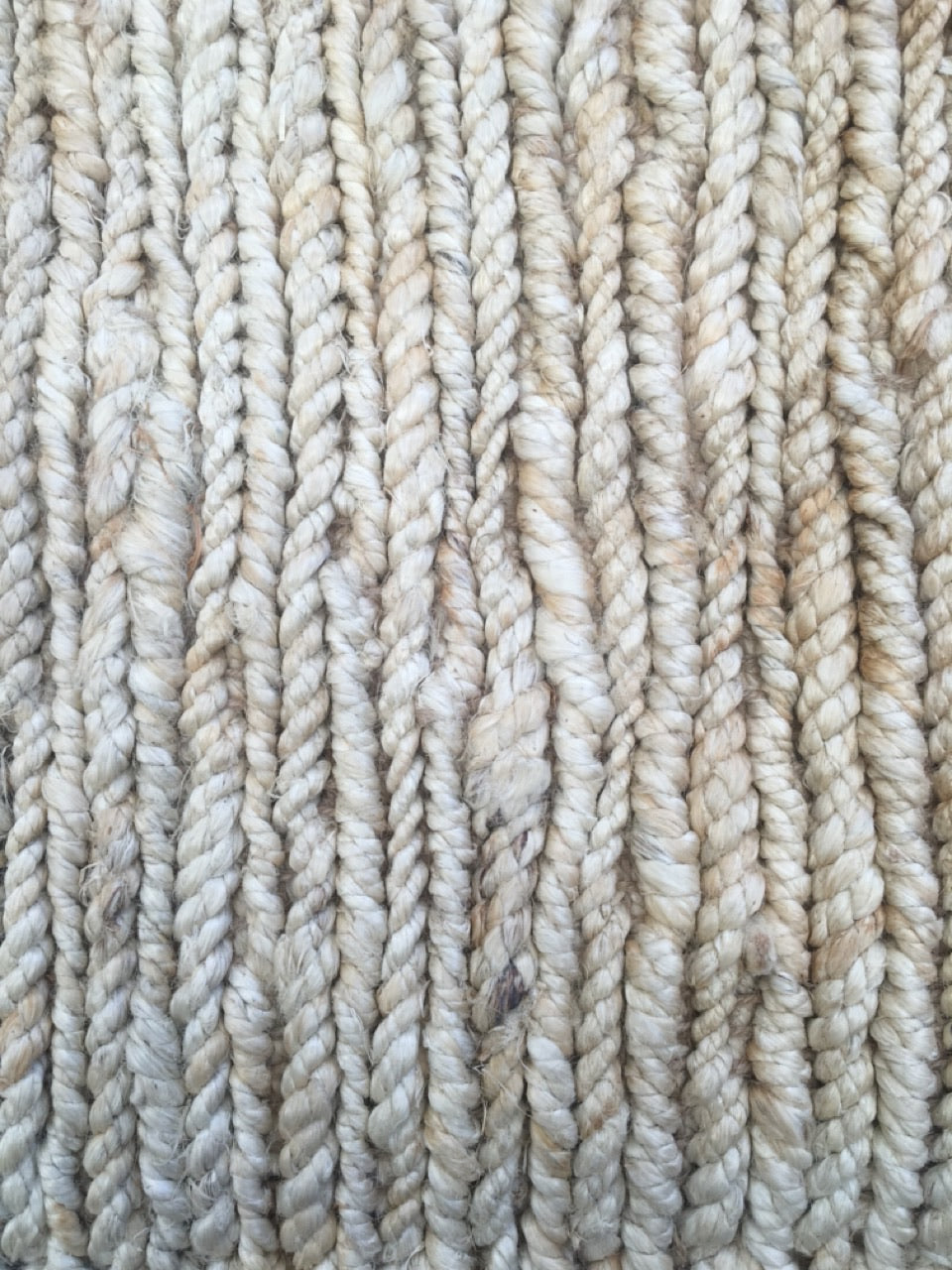 Byron Bleach hand-woven hemp rug in a braided-style flatweave. Bleached white. Sizes 155 x 225, 200 x 290 and 240 x 320 cm. Top close view.