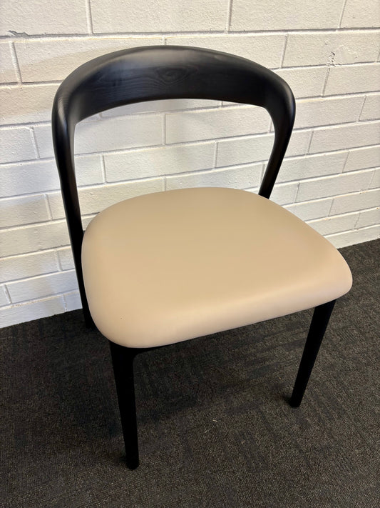 The Cheyenne Black and Grey dining chair features a modern style and design. Crafted with a solid ash frame and a smooth padded grey polyurethane seat. Colour Black Frame with Grey seat. Measures 500 wide X 520 depth X 460 Seat height. Back height 750. Angle.