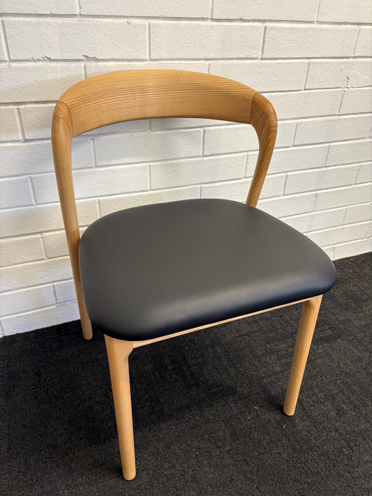 The Cheyenne Natural and Black dining chair features a modern style and design. Crafted with a solid ash frame and a smooth padded black polyurethane seat. Colour Natural Frame with Black seat. Measures 500 wide X 520 depth X 460 Seat height. Back height 750. Angle.