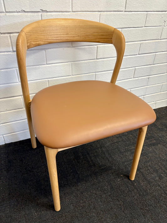 The Cheyenne Natural and Tan dining chair features a modern style and design. Crafted with a solid ash frame and a smooth padded tan polyurethane seat. Colour Natural Frame with Tan seat. Measures 500 wide X 520 depth X 460 Seat height. Back height 750. Angle.