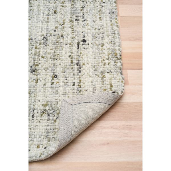 Cleo Green hand-woven wool flatweave rug in a muted olive tone, with a flecked, cross-woven texture and flat woven border. 3 Sizes. Fold view.