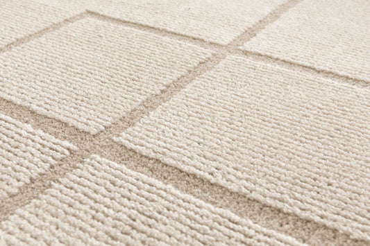 Cocoon - Beige, a modern rug design crafted with a unique blend of Heat Set Polypropylene and Polyester shrink yarn. Top Close.