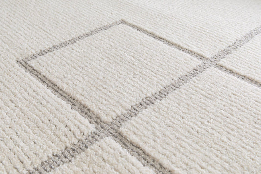 Cocoon - Light Grey, a modern rug design crafted with a unique blend of Heat Set Polypropylene and Polyester shrink yarn. Top Close.