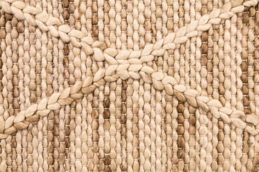 Colombo Natural is a hand made flatweave rug. Made from 80% wool and 20% polyester, it features a braided diamond pattern for an extra textured feel. Colour Creamy Beige with Brown accents. Sizes 155 X 225, 200 X 290, 240 X 320 and 300 X 400. Close.