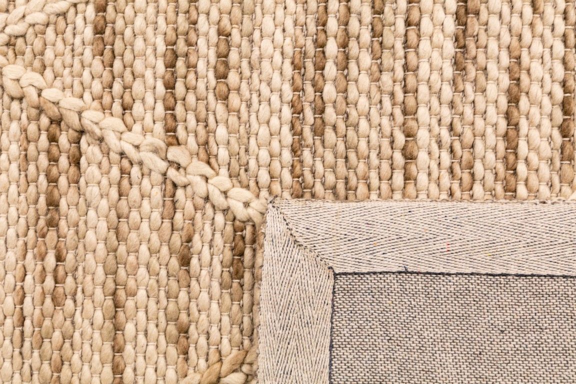 Colombo Natural is a hand made flatweave rug. Made from 80% wool and 20% polyester, it features a braided diamond pattern for an extra textured feel. Colour Creamy Beige with Brown accents. Sizes 155 X 225, 200 X 290, 240 X 320 and 300 X 400. Fold.