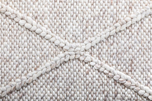 The Colombo Runner - Beige is a textured hand woven hallway runner rug. Made from 80% wool and 20% polyester, it features a braided diamond pattern for an extra textured feel. Colour Beige. Size 80 wide x 320 Length. Close.