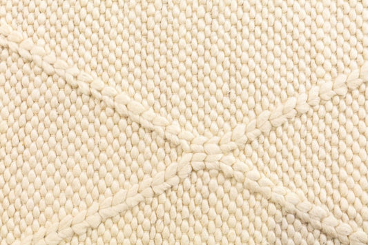The Colombo Runner - Cream is a textured hand woven hallway runner rug. Made from 80% wool and 20% polyester, it features a braided diamond pattern for an extra textured feel. Colour Cream. Size 80 wide x 320 Length. Close.