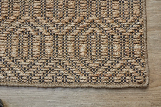 Daintree - Nevada is a rug made with panja hand woven natural coloured jute. Features a 7-9mm pile height and geometic design. Colour Natural with Black. Sizes 160 X 230, 200 X 290 and 240 X 340. Corner.