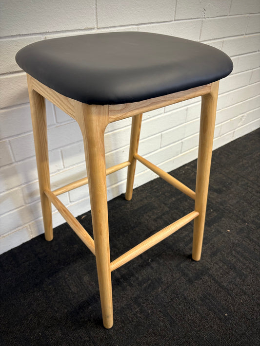 The Danube - Natural Black Barstool. A contemporary style barstool. Solid natural ash frame with black polyurethane seat. Measures 400W X 400D X 670 Seat Height. Angle.