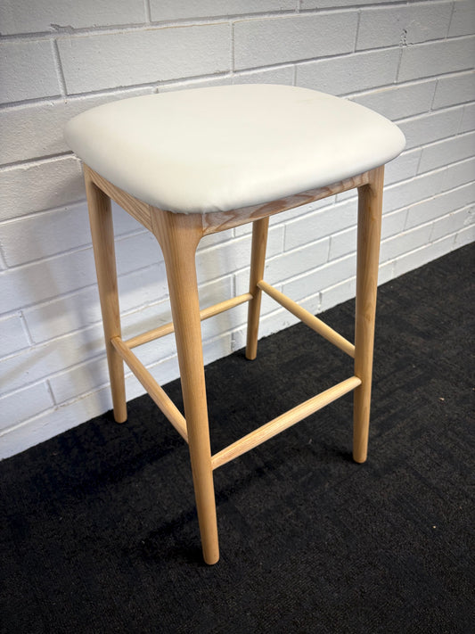 The Danube - Natural and White Barstool. A contemporary style barstool. Solid natural ash frame with white polyurethane seat. Measures 400W X 400D X 670 Seat Height. Angle.