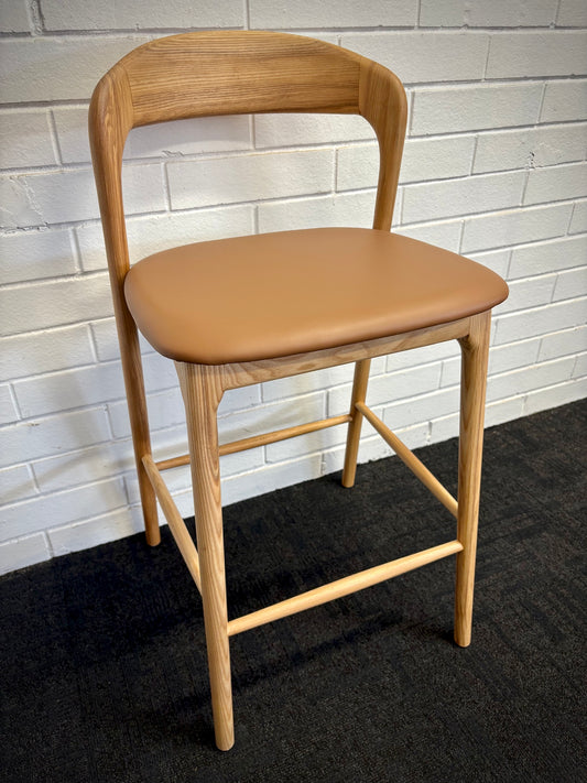The Danube with Back - Natural / Tan Barstool. A contemporary style barstool. Solid natural ash frame with tan polyurethane seat. Measures 470W X 450D X 670 Seat Height. Back Height 920. Angle.
