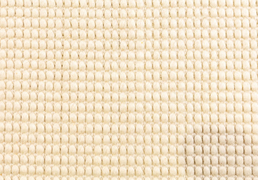 Dasha Round - Cream rug. Made of 80% wool and 20% polyester, this round rug features a unique textured design that adds a cozy and inviting feel to any room. Measuring 200cm in diameter. Close.