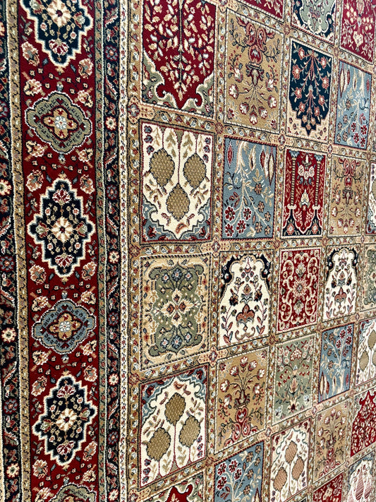 The Davinci Bakhtiari Dark Persian Rug. Machine made and crafted with heat-set polypropylene for long-lasting durability. Featuring a traditional Persian design. Colours, multi. 4 Sizes. Close Angle.