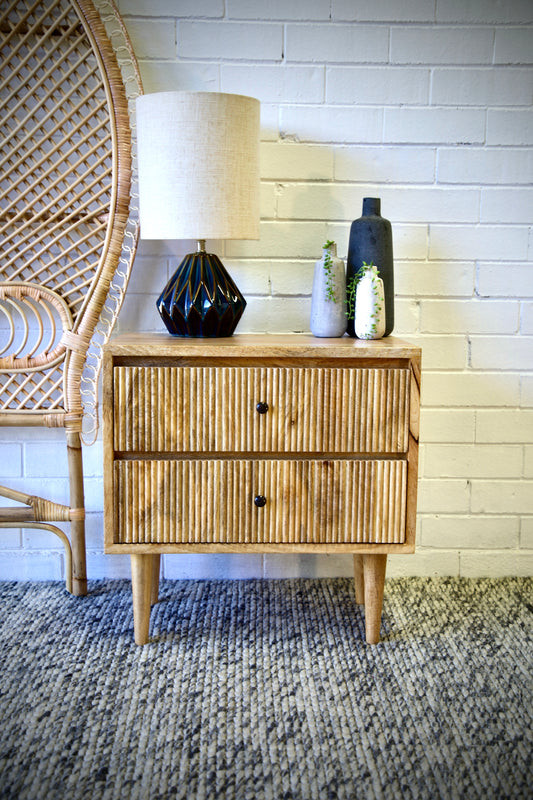 The Denali 2 Drawer bedside is a contemporary designed bedside. It features 2 drawers with a textured front and is crafted from sustainable fruitwood. Colour natural. Measures 600 wide X 350 depth X 610 height. Front Styled.