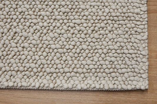 Dunes Ivory is a hand-braided wool rug, giving it a textured, luxurious feel. With a 16-18mm pile height. Colour Ivory. Sizes 160 X 230, 200 X 290 and 240 X 340. Corner.