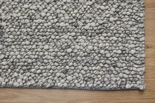 Dunes Storm is a hand-braided wool rug, giving it a textured, luxurious feel. With a 16-18mm pile height. Colour Light grey and white. Sizes 160 X 230, 200 X 290 and 240 X 340. Corner.