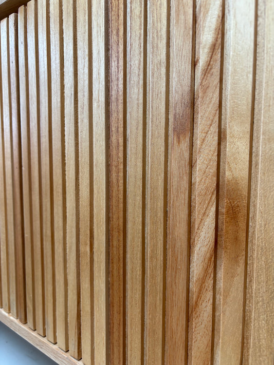 The Eastwood Natural Entertainment Unit. 4 textured doors with smart storage behind the left door featuring 3 drawer. Colour Natural. Measures 1800 wide X 400 depth x 650 height. Close.