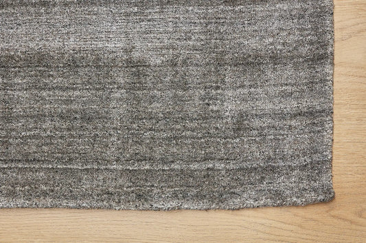 Ethnic Taupe is a luxurious hand loomed carpet made of 80% wool and 20% bamboo silk. The finely crafted material creates a super soft texture and a smooth pile height of 16-18mm. Colour Silver Beige. Sizes 160 X 230, 200 X 290 and 240 X 340. Corner.