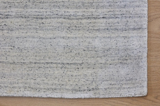 Ethnic White is a luxurious hand loomed carpet made of 80% wool and 20% bamboo silk. The finely crafted material creates a super soft texture and a smooth pile height of 16-18mm. Colour White with Black accents. Sizes 160 X 230, 200 X 290 and 240 X 340. Corner.