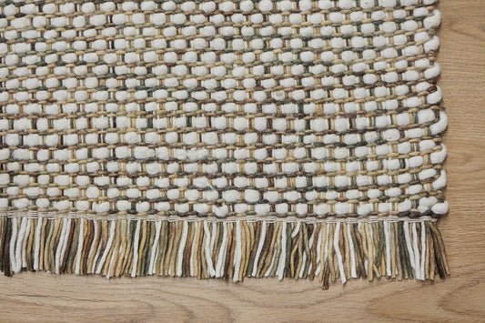 Fancy Foam is a hand braided wool rug with a sumptuous 12-14mm medium pile height. Colours White and greyish beige accents. Sizes 160 X 230, 200 X 290, 240 X 340. Corner.