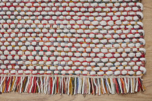 Fancy Red is a hand braided wool rug with a sumptuous 12-14mm medium pile height. Colours White with red and multi coloured accents. Corner.Fancy Red is a hand braided wool rug with a sumptuous 12-14mm medium pile height. Colours White with red and multi coloured accents. Sizes 160 X 230, 200 X 290, 240 X 340. Corner.