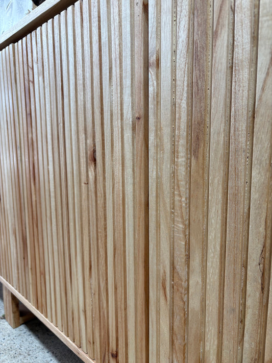 The Florence Natural Buffet. 4 textured doors with smart storage behind the left door featuring 4 drawers. Colour Natural. Measures 1800 wide X 400 depth x 900 height. Front Angle.