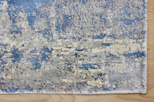 Fusion Blue is a handcrafted rug made of luxurious bamboo silk and viscose. It features a textured, intricate, and opulent weave with a pile height of 12-14mm. Colours Blue and Grey Blend. Sizes 160 X 230, 200 X 290 and 240 X 340. Corner.