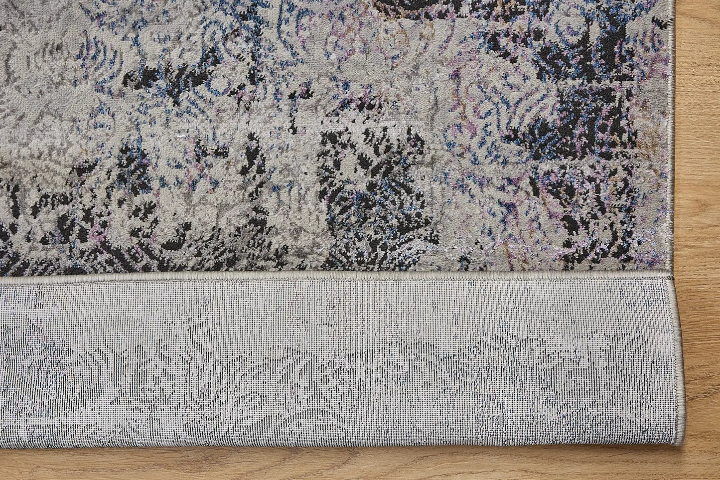 Geneva Grey is a machine made rug. Its design boasts a abstract modern/contemporary feel. Crafted from Viscose and Polyester, with a low-profile 7-9mm pile height. Colours Light Grey with Blue and Black accent tones. Sizes 160 X 230, 200 X 290 and 240 X 340. Fold.