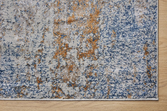 Geneva Silver is a machine made rug. Its design boasts a modern/contemporary feel. Crafted from Viscose and Polyester, with a low-profile 7-9mm pile height. Colours, Light Grey with Blue and Beige and white accent tones. Sizes 160 X 230, 200 X 290 and 240 X 340. Corner.