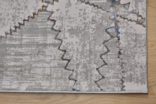 Geneva Taupe is a machine made rug. Its design boasts a abstract modern/contemporary feel. Crafted from Viscose and Polyester, with a low-profile 7-9mm pile height. Colours, Light Grey with Blue and white accent tones. Sizes 160 X 230, 200 X 290 and 240 X 340. Corner.