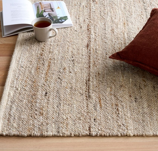 Harmony Beige Rug – hand-woven blend of wool and viscose in soft natural tones, featuring a textured finish that’s both elegant and durable. Colour White, Grey, black and brown flecks. 4 sizes. Life.