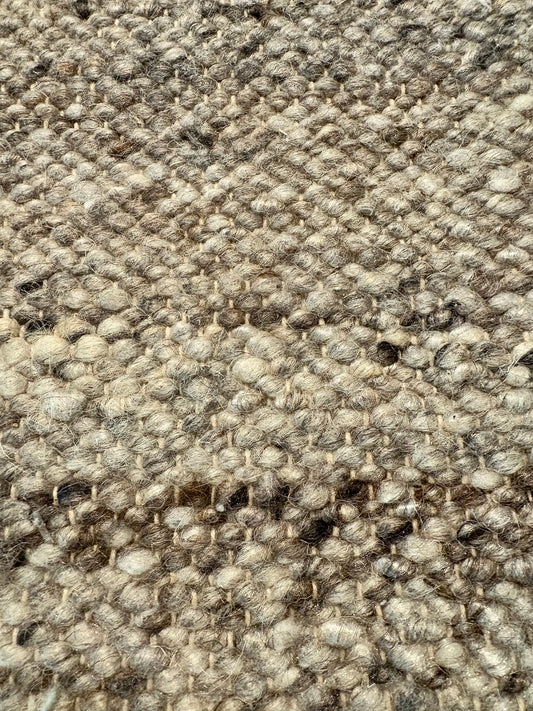 Harmony Dark Grey Rug – hand-woven blend of wool and viscose in soft natural tones, featuring a textured finish that’s both elegant and durable. Colour White, Grey, black and brown flecks. 3 sizes. Close.