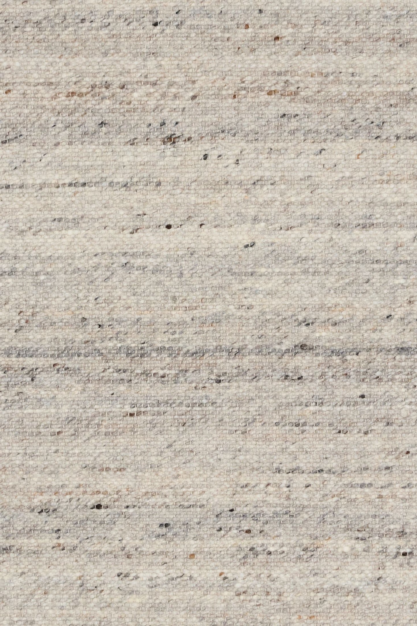 Harmony Smoke Grey Rug – hand-woven blend of wool and viscose in soft natural tones, featuring a textured finish that’s both elegant and durable. Colour White, Grey, black and brown flecks. 4 sizes. Close.