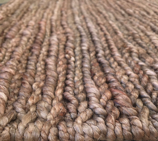 The Hemp Round - Coffee, hand-woven rug. Made in India, it features a round shape in two sizes, 160 and 190 Diameter. Colour, Coffee Brown. Angle.