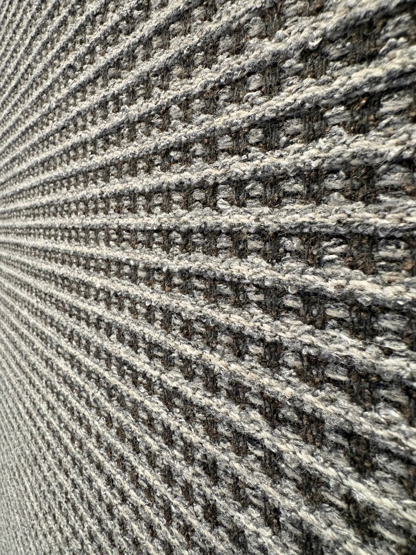 Katana Grey indoor/outdoor rug featuring a subtle textured pattern, power-loomed from UV-stabilised polypropylene for lasting durability. Colour grey. 3 sizes. Close Angle.