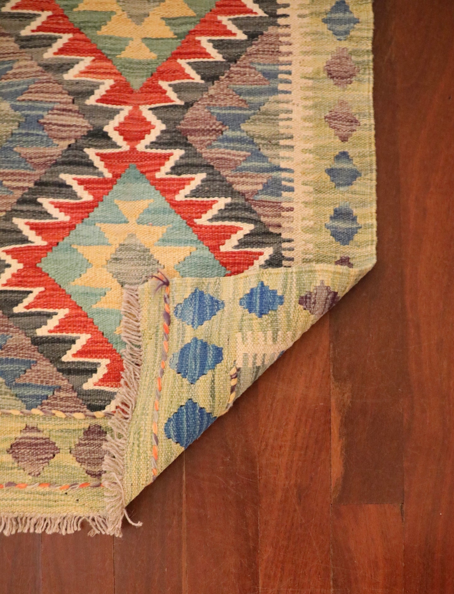 The Afghan Hand Woven Khyber Kilim - 59 X 90. Crafted using traditional vegetable dyed wool, and featuring traditional geometric designs. Colours, beiges, blues, creams, light greens, light blues and yellows. Size 59 X 90. Fold.